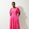 Product photo of a model wearing a bright pink v-neck button-up dress with short wide sleeves